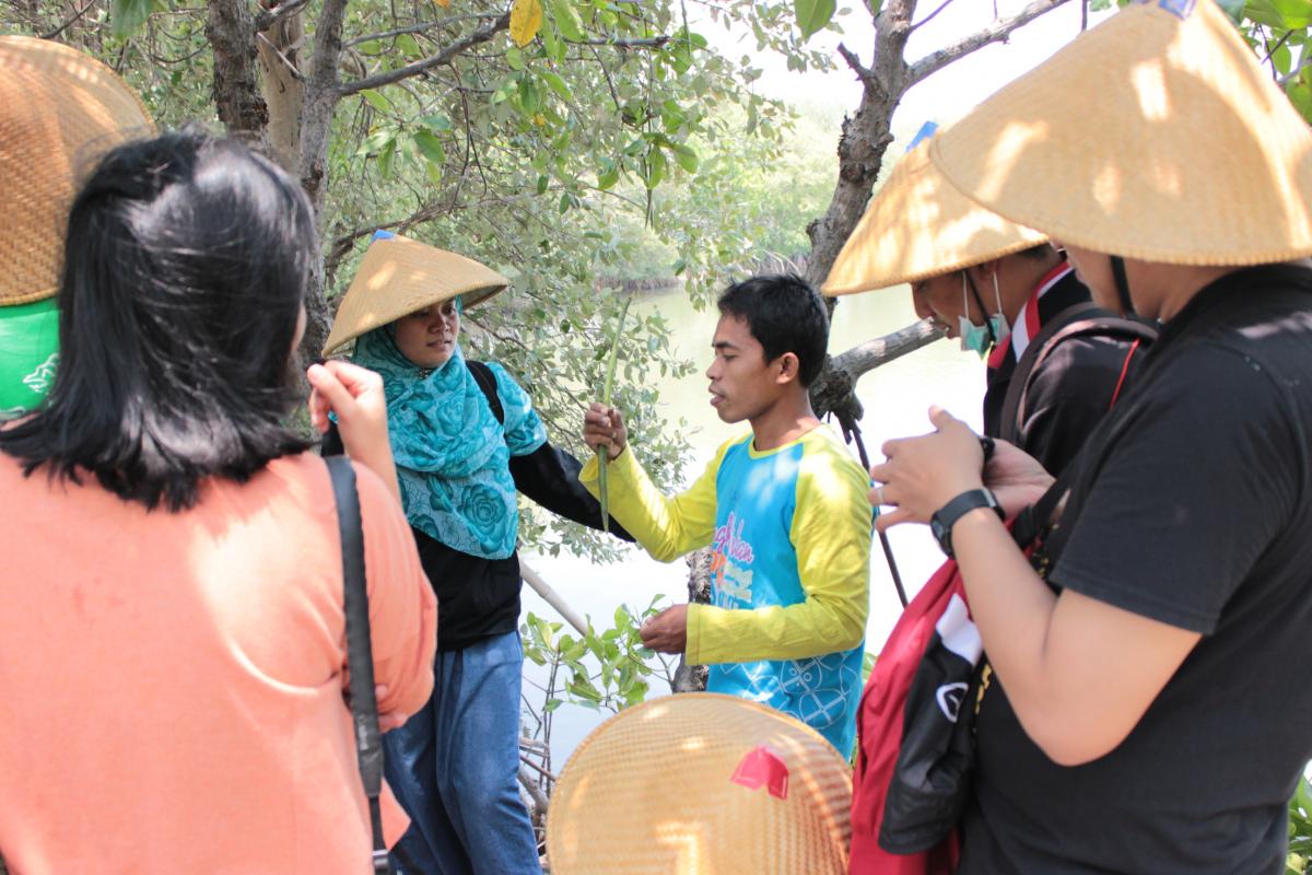 The journalists interviewed Arifin, a local community member at a mangrove restoration project site in Semarang, Indonesia.